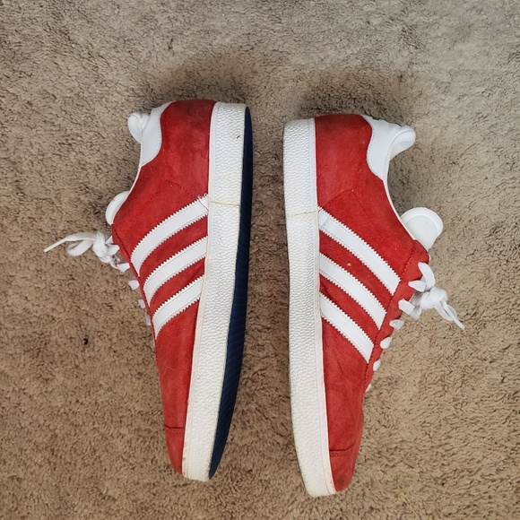 white adidas shoes with colorful bottoms